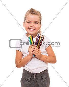 Little girl holding a few colorful pencils on white