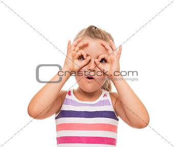 little girl standing on white background and pretending that hol
