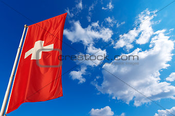 Switzerland Flag in Blue Sky