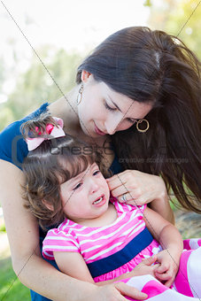 Loving Mother Consoles Crying Baby Daughter