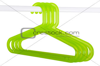 Green hangers on a rod isolated on white