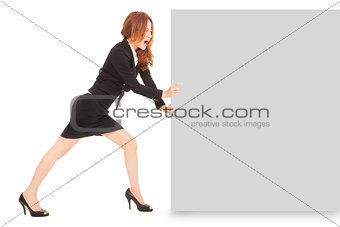 Young businesswoman pushing a blank board on white background