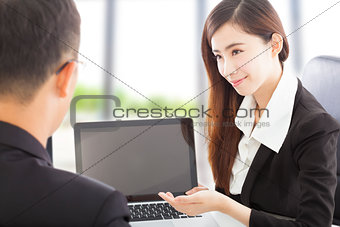 smiling Business woman presenting and explaining a project 