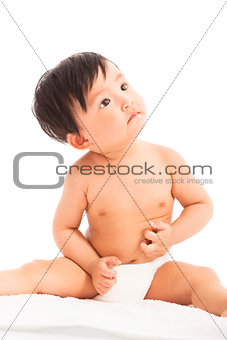 curious Infant child baby toddler sitting and look up