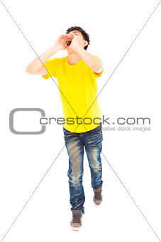  young man walking while raising hands to yell