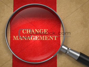Change Management. Magnifying Glass on Old Paper.