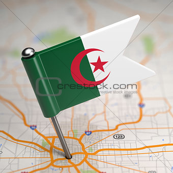 Algeria Small Flag on a Map Background.