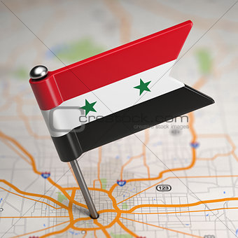 Syria Small Flag on a Map Background.