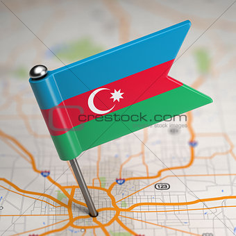 Azerbaijan Small Flag on a Map Background.