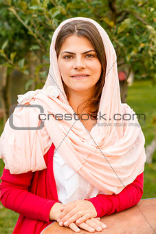 Beautiful middle eastern woman in pink scarf.