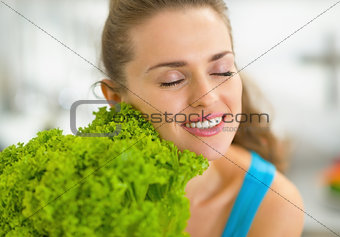 Portrait of young woman enjoying fresh salad