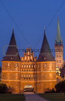 Holstein gate and Petri church by night in Lubeck