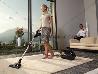 housewife with vacuum cleaner