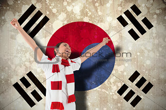 Excited asian football fan cheering