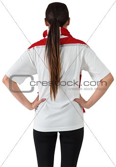 Football fan in white with hands on hips