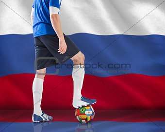 Football player standing with ball