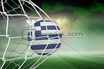 Football in greece colours at back of net