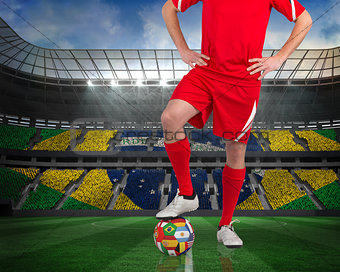 Football player standing with flag ball