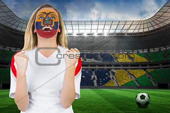 Excited ecuador fan in face paint cheering