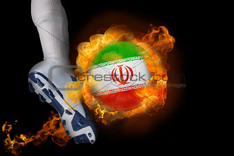 Football player kicking flaming iran ball