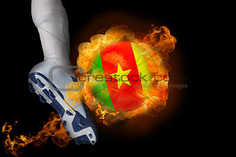 Football player kicking flaming cameroon ball