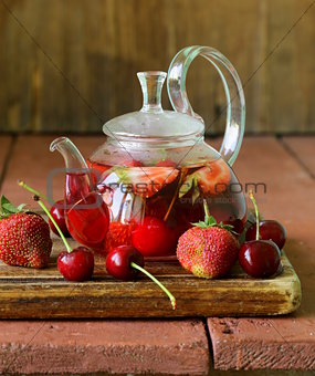 summer fruit tea with a variety of berries (cherry, strawberry)