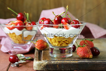 Dairy yogurt dessert with cherries and strawberries