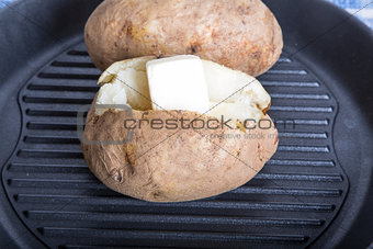 Two Baked Potatoes in Black Pan
