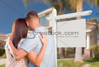 Blank Real Estate Sign and Military Couple Looking at House