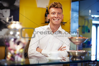 happy man working as barman smiling in bar