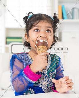 Indian girl eating ice cream. 