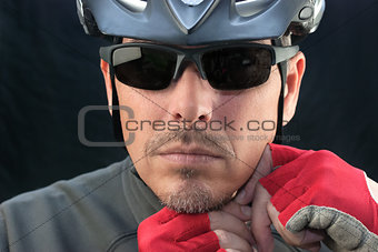 Bicycle Courier Puts On Helmet