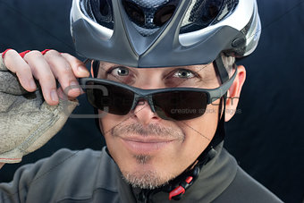 Friendly Bicycle Courier Looks Over Sunglasses
