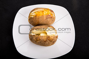 Two Baked Potatoes on White Plate
