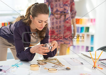 Fashion designer choosing accessories