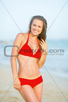Portrait of happy young woman on beach