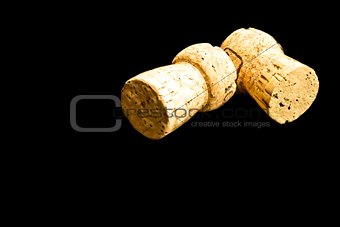 two cork on black background