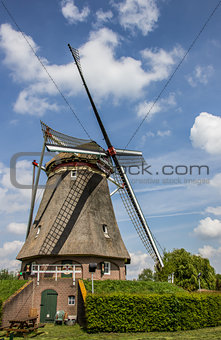 Beatrix mill in Winssen against a blue sky