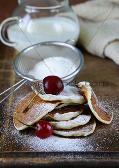 sweet dessert pancakes with powdered sugar for breakfast