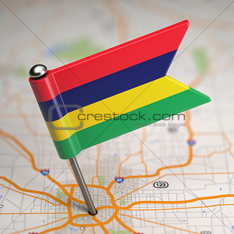 Mauritius Small Flag on a Map Background.