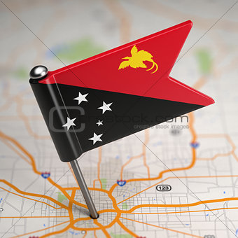 Papua New Guinea Small Flag on a Map Background.