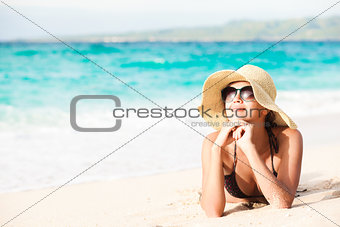 long haired girl in bikini on tropical beach