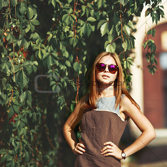 Beautiful teenage girl in sunglasses.