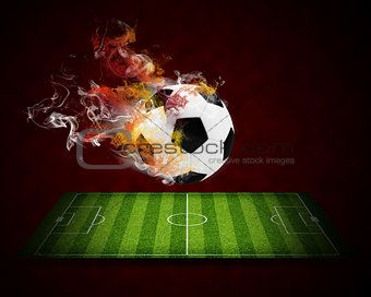 Soccer ball in the color of flame and smoke