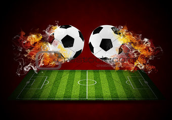 Two soccer balls in the color of flame and smoke