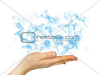 Hand holding blue smoke