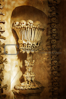 Skulls and bones. Kutna Hora, Czech Republic. textured old paper