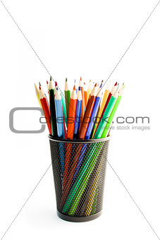 colored pencils in a container on white background