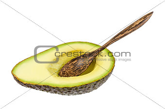 Fresh avocado with wooden spoon isolated