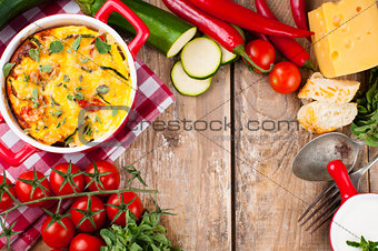Vegetable casserole in a red pot